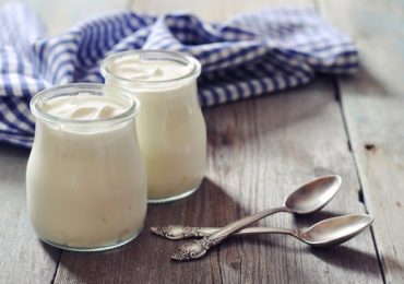 jars-of-yogurt-on-a-wooden-table